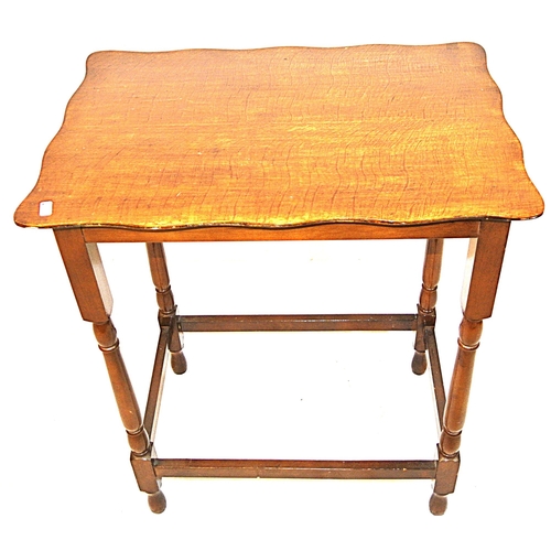 79 - Edwardian mahogany occasional table with wavy rims and turned columns