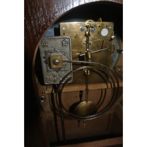 102 - Edwardian oak domed mantle clock with enamel dial and reeded decoration