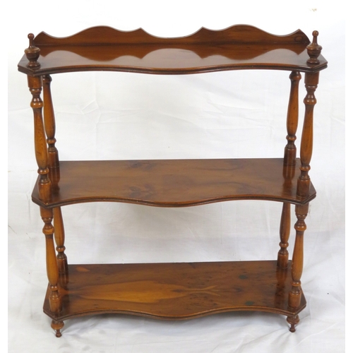 103 - Edwardian walnut serpentine fronted 3 tier shelf with shaped finials and columns