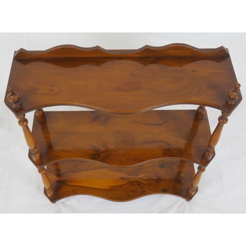 103 - Edwardian walnut serpentine fronted 3 tier shelf with shaped finials and columns