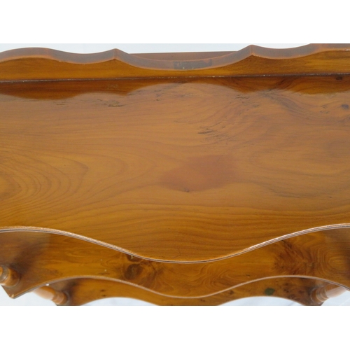 103 - Edwardian walnut serpentine fronted 3 tier shelf with shaped finials and columns