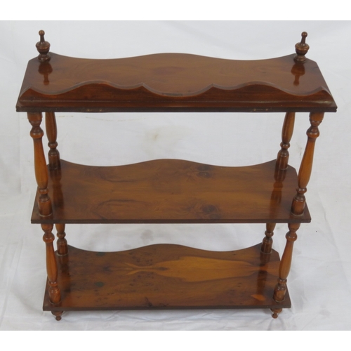 103 - Edwardian walnut serpentine fronted 3 tier shelf with shaped finials and columns