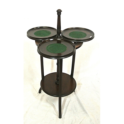 104 - Edwardian mahogany triple cake stand with swivel trays with raised rims, on reeded shaped legs