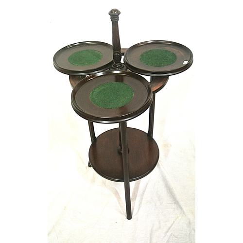 104 - Edwardian mahogany triple cake stand with swivel trays with raised rims, on reeded shaped legs