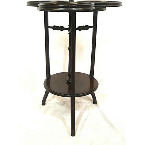 104 - Edwardian mahogany triple cake stand with swivel trays with raised rims, on reeded shaped legs
