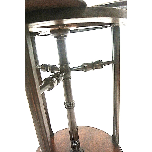 104 - Edwardian mahogany triple cake stand with swivel trays with raised rims, on reeded shaped legs