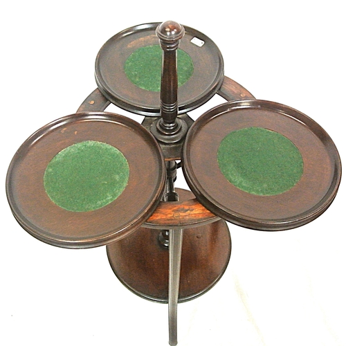 104 - Edwardian mahogany triple cake stand with swivel trays with raised rims, on reeded shaped legs
