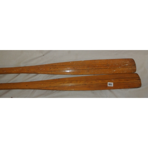108 - Pair of inlaid pine oars and a paddle
