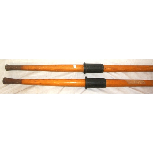108 - Pair of inlaid pine oars and a paddle