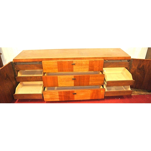 110 - Vintage teak sideboard by J Lichtenberg & Sons, New York, with shelved side presses, 3 central drawe... 