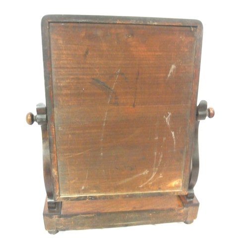 112 - Edwardian mahogany swivel mirror with shaped columns, lid, on bun feet