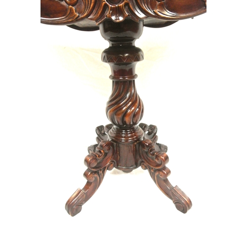 115 - Victorian design mahogany tea table with swivel fold over top, serpentine borders, foliate carved fr... 