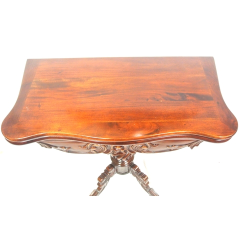 115 - Victorian design mahogany tea table with swivel fold over top, serpentine borders, foliate carved fr... 