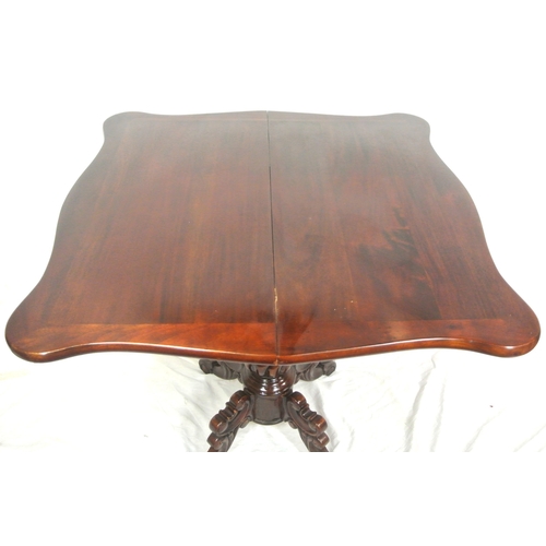 115 - Victorian design mahogany tea table with swivel fold over top, serpentine borders, foliate carved fr... 