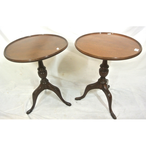 119 - Pair of Edwardian style round wine or lamp tables with raised rims, vase turned columns, on hipped t... 