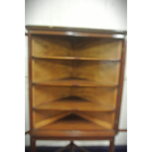 120 - Edwardian mahogany corner display cabinet with reeded frieze, glazed doors with shelved interior, on... 