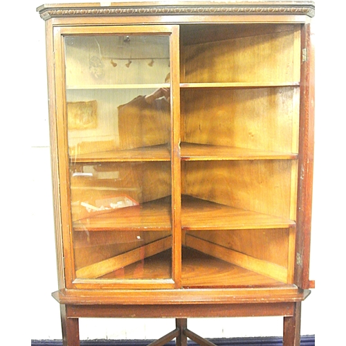 120 - Edwardian mahogany corner display cabinet with reeded frieze, glazed doors with shelved interior, on... 