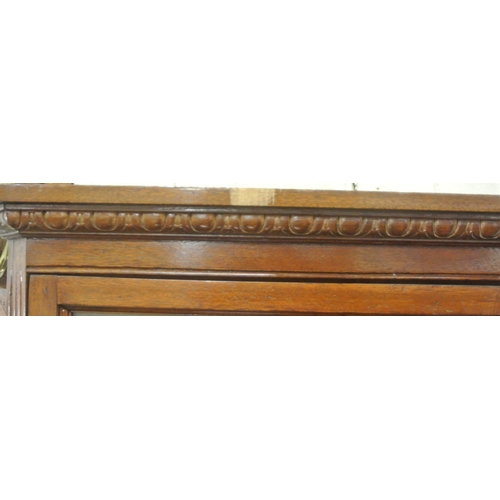 120 - Edwardian mahogany corner display cabinet with reeded frieze, glazed doors with shelved interior, on... 