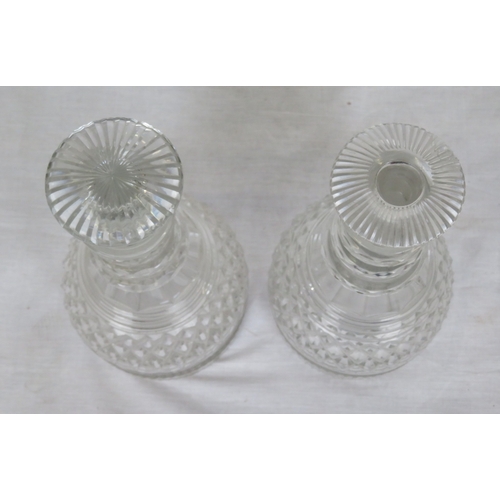 184 - Pair of Irish cut glass 3-ring decanters with panelled and diamond decoration and stoppers