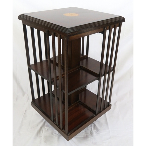 196 - Edwardian design inlaid and crossbanded mahogany revolving bookcase with railed sides, in shaped bas... 