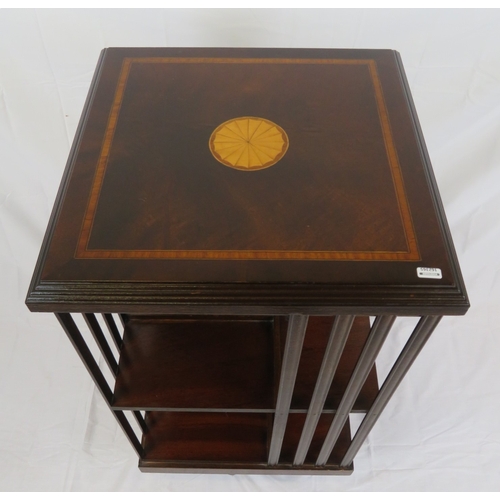196 - Edwardian design inlaid and crossbanded mahogany revolving bookcase with railed sides, in shaped bas... 
