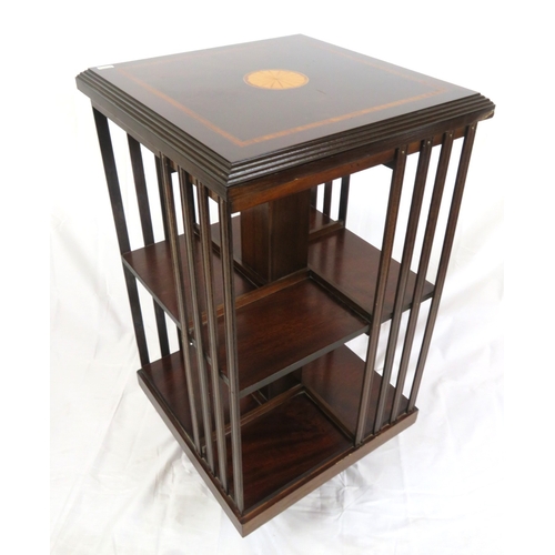 196 - Edwardian design inlaid and crossbanded mahogany revolving bookcase with railed sides, in shaped bas... 