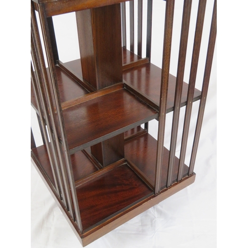 196 - Edwardian design inlaid and crossbanded mahogany revolving bookcase with railed sides, in shaped bas... 