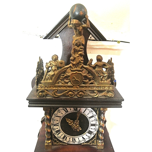 207 - Dutch style mahogany clock with revolving Atlas figure and round dial