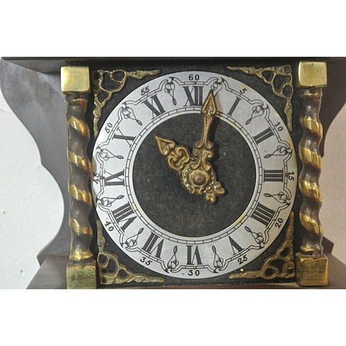 207 - Dutch style mahogany clock with revolving Atlas figure and round dial