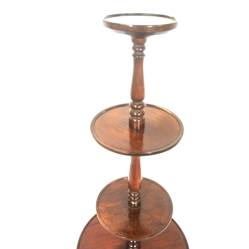 215 - Edwardian mahogany 4 tier round dumbwaiter with raised rims, baluster columns, on hipped tripod with... 