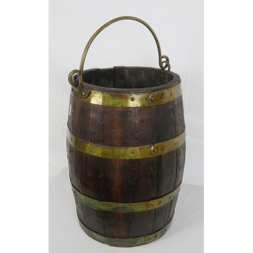 219 - Georgian style round peat bucket with brass banding and shaped handle