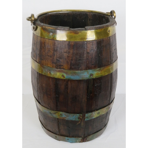 219 - Georgian style round peat bucket with brass banding and shaped handle