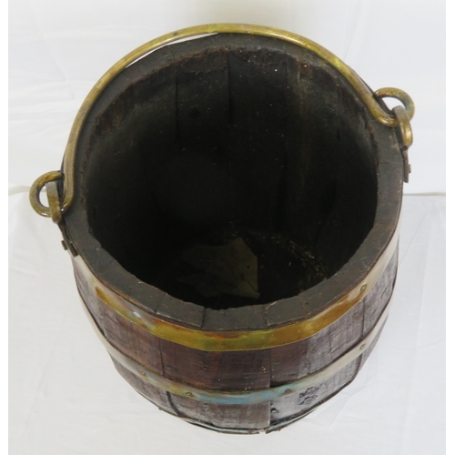 219 - Georgian style round peat bucket with brass banding and shaped handle
