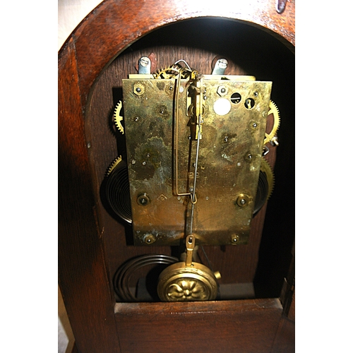 226 - Edwardian oak cased domed bracket clock with round brass framed dial and shell inlay