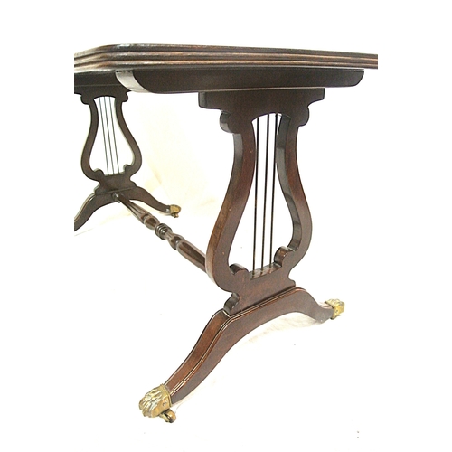 81 - Edwardian design mahogany coffee table with reeded borders, lyre supports on splayed legs with caste... 