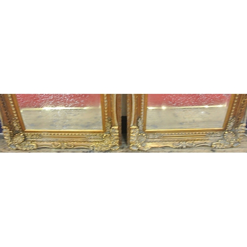 90 - Pair of Regency style gilt framed bevelled glass mirrors with ornate foliate, scroll and beaded deco... 