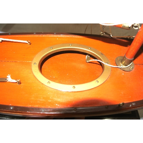 93 - Hand crafted timber model of gaff rigged yacht on stand