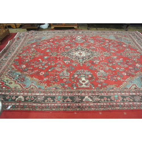 321 - Red ground Persian Sarouk full pile carpet with traditional floral design  350 x 255 cm