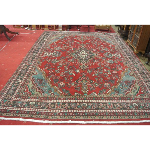 321 - Red ground Persian Sarouk full pile carpet with traditional floral design  350 x 255 cm