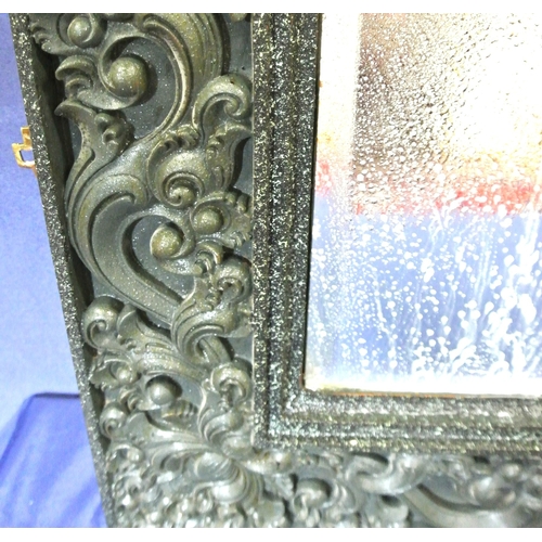 307 - Oriental style bevelled glass wall mirror with ornate foliate & scroll decorated frame