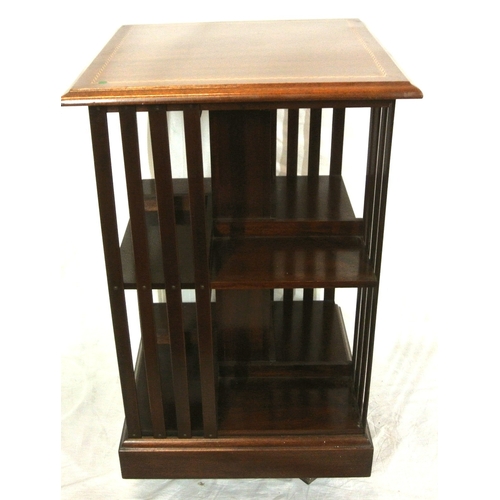 325 - Edwardian design inlaid mahogany revolving bookcase with railed sides & shaped base