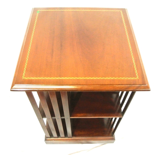 325 - Edwardian design inlaid mahogany revolving bookcase with railed sides & shaped base