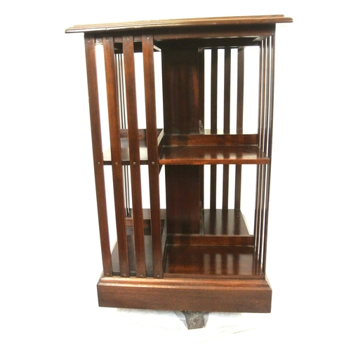 325 - Edwardian design inlaid mahogany revolving bookcase with railed sides & shaped base