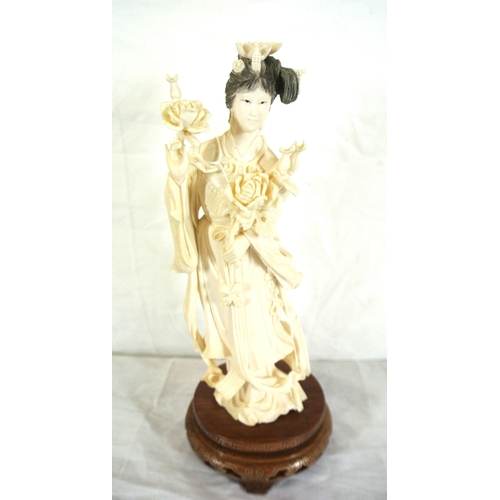 326 - Oriental figure of Guanyin or a Lady with roses, on inlaid teak base
