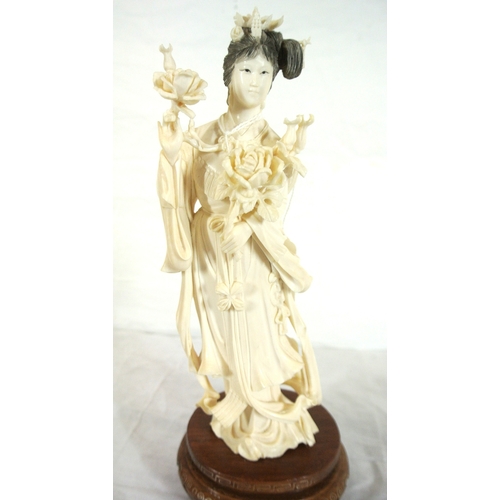 326 - Oriental figure of Guanyin or a Lady with roses, on inlaid teak base