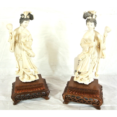 327 - Pair of Oriental figures of Ladies with music bowls on pierced timber stands