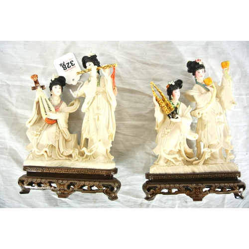 328 - Pair of Oriental figured groups of musical Geishas, holding musical instruments, on inlaid timber ba... 