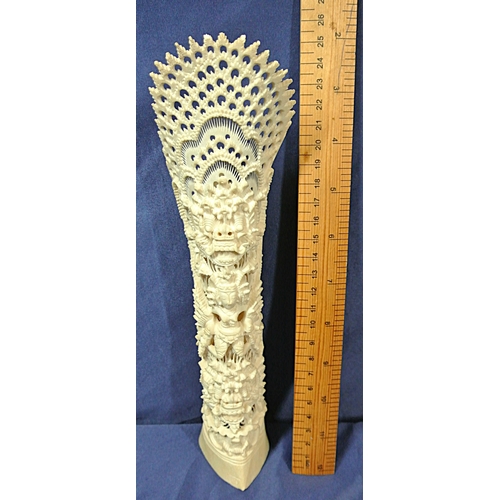 330 - Oriental carved Bali totem with figure of a deity and serpent