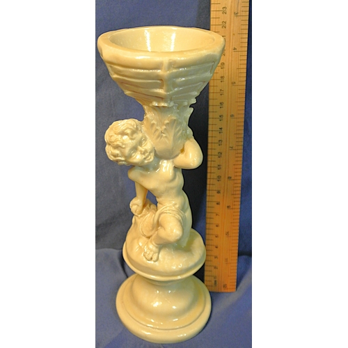 336 - Vintage resin figure of a boy holding a basket, on stepped base