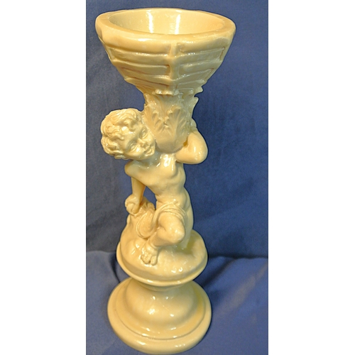336 - Vintage resin figure of a boy holding a basket, on stepped base